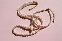 Cross of PAWA: High Lustre Cross Shape Baroque and Round White Pearl Necklace