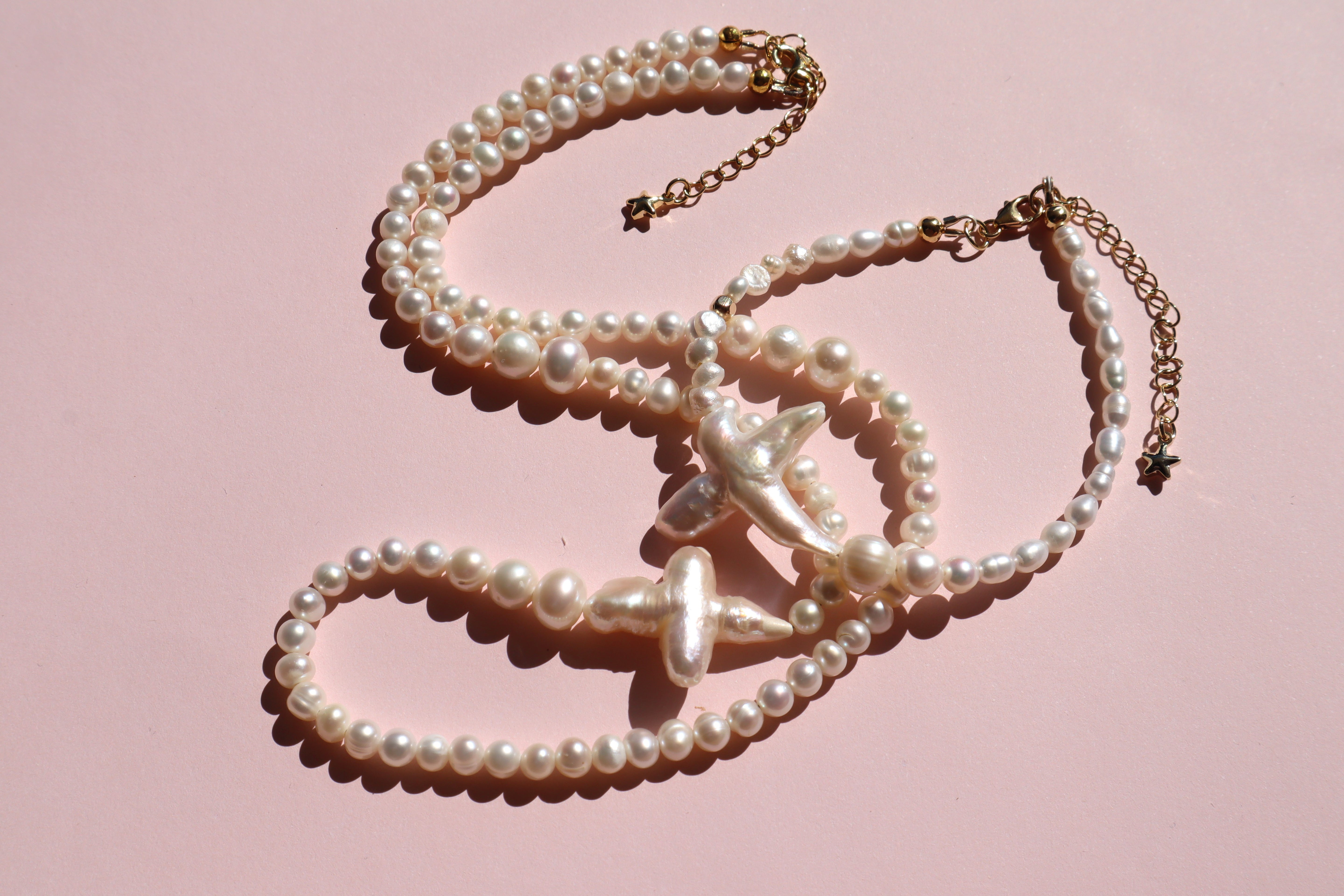 Cross of PAWA: High Lustre Cross Shape Baroque and Round White Pearl Necklace