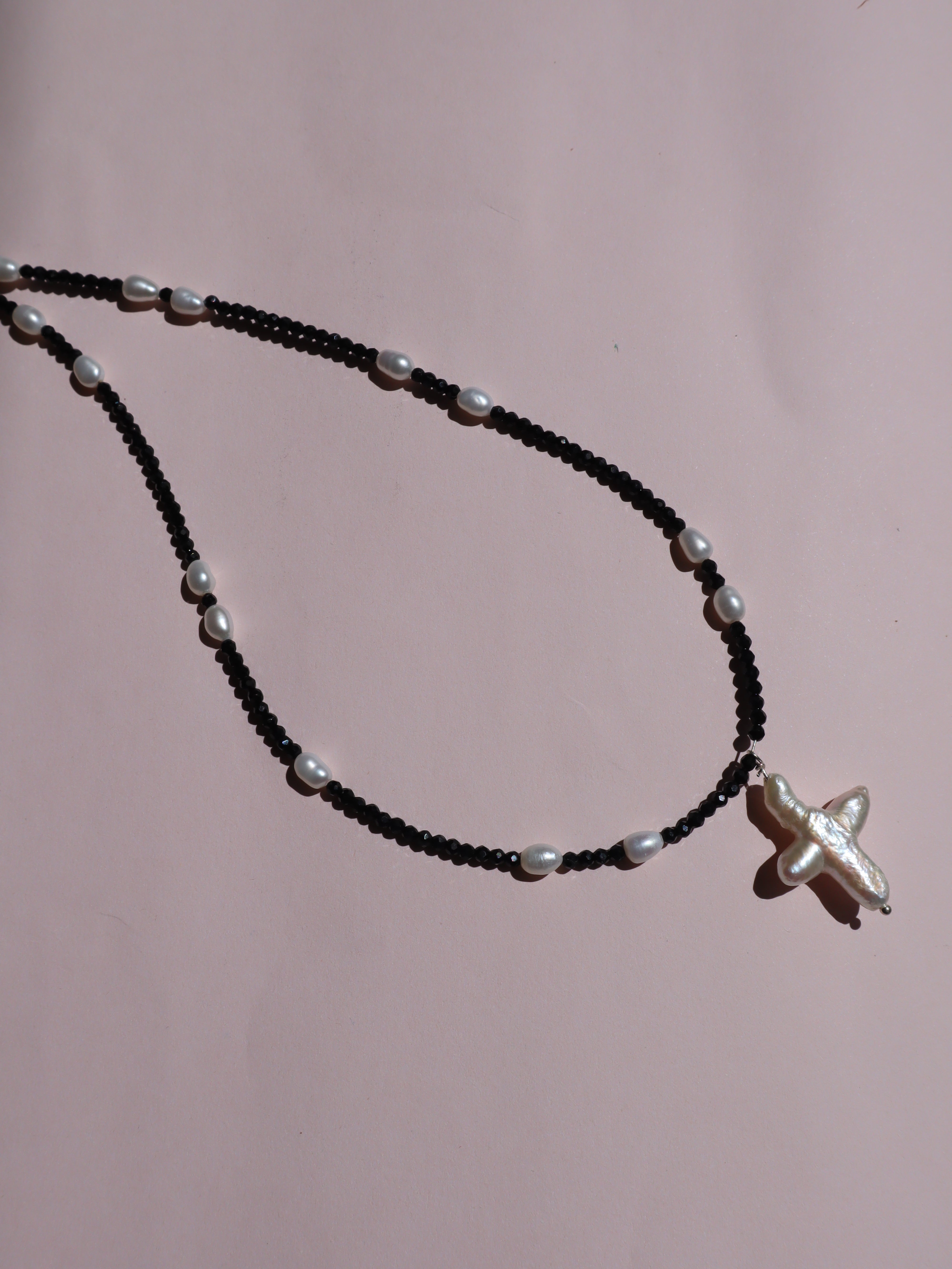 Cross of PAWA: High Lustre Cross Shape Baroque White Pearl Black Spinel Necklace