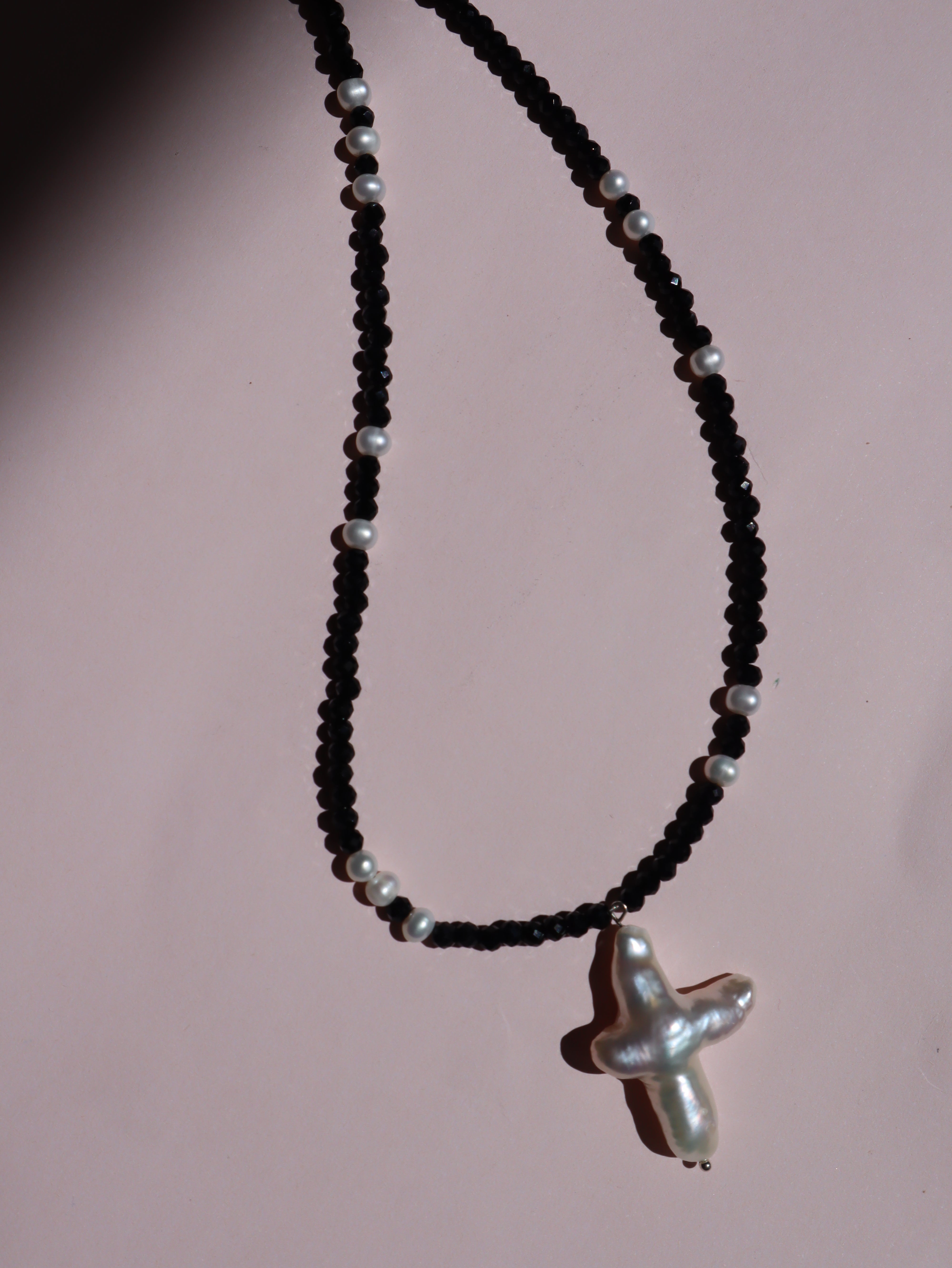 Cross of PAWA: High Lustre Cross Shape Baroque White Pearl Black Spinel Necklace