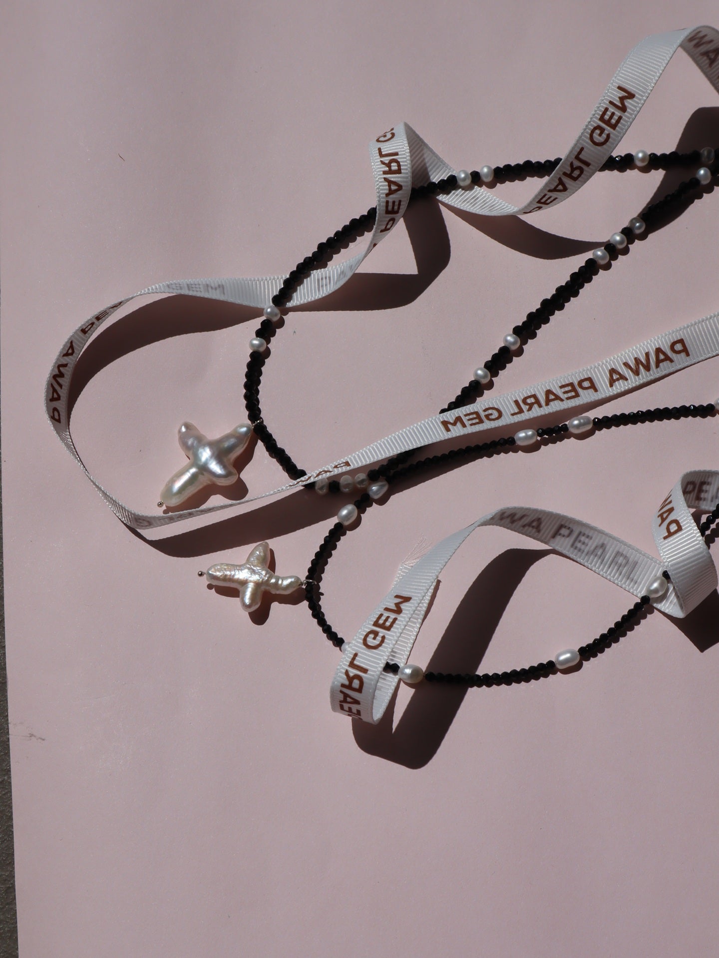 Cross of PAWA: High Lustre Cross Shape Baroque White Pearl Black Spinel Necklace